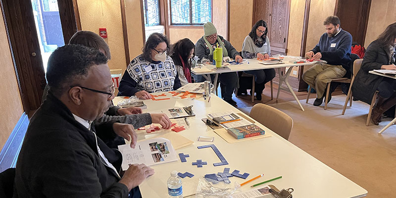 Back in the playroom, teachers work with 2D pentominoes and use their unique shapes to create architectural floorplans.