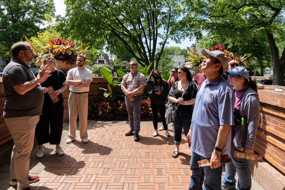 A volunteer interpreter welcomes guests to Heurtley House