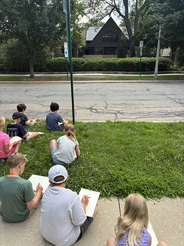 Campers sketch the front of Frank Lloyd Wright’s home.
